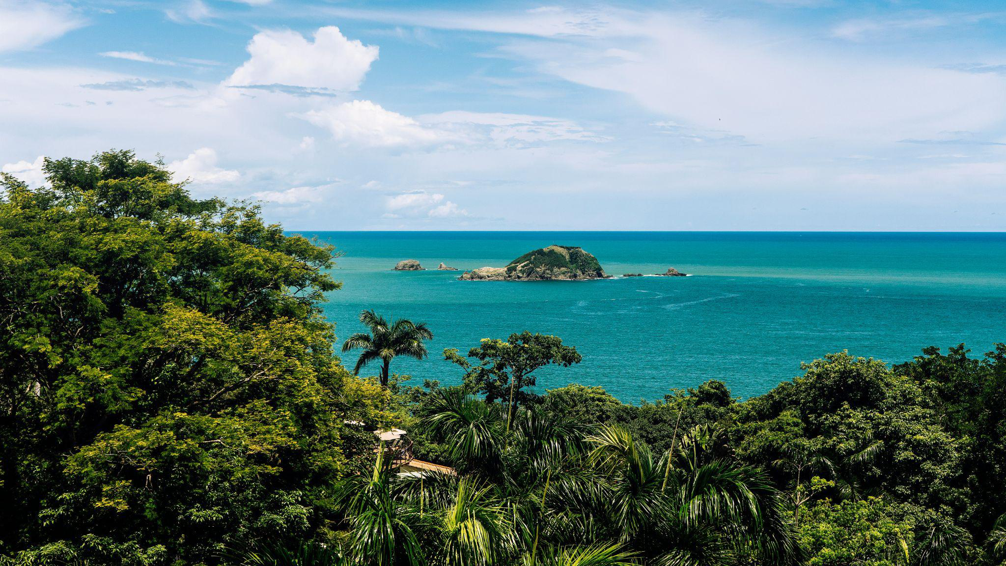 Scenic view of the Pacific Ocean with tropical greenery in Costa Rica.