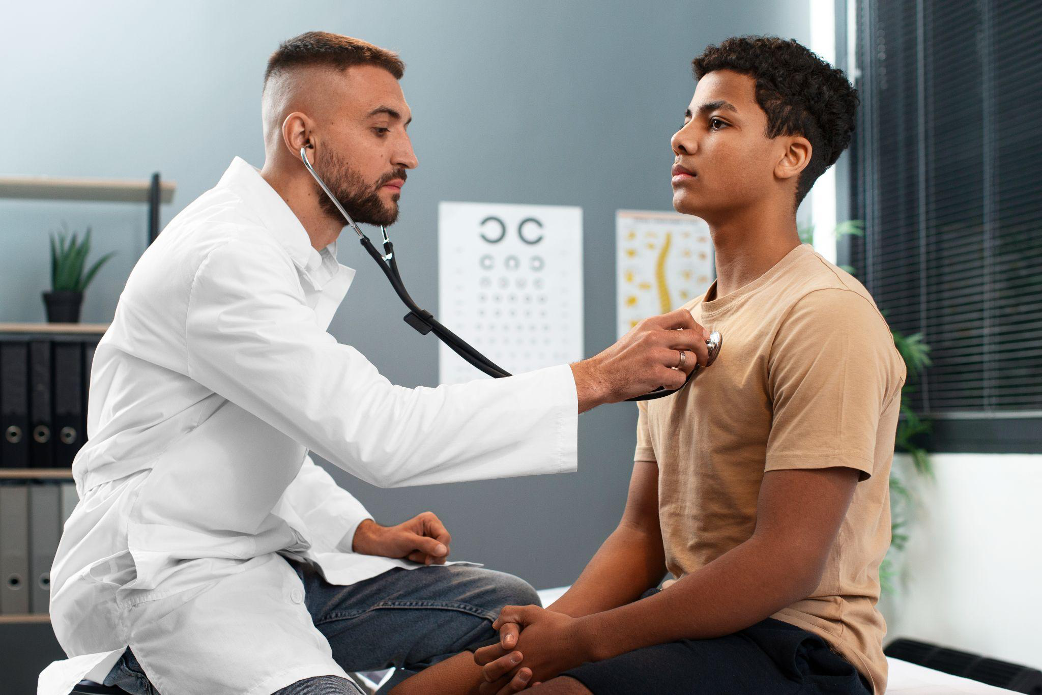 Doctor examining a young patient in a modern medical office.