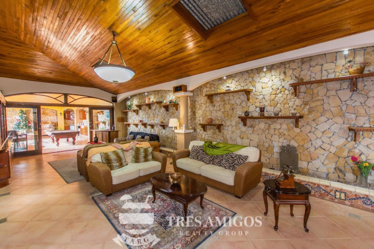 Spacious living room with wooden ceiling in a Papagayo villa.