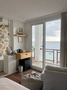 an interior space with wooden floors and sliding doors.