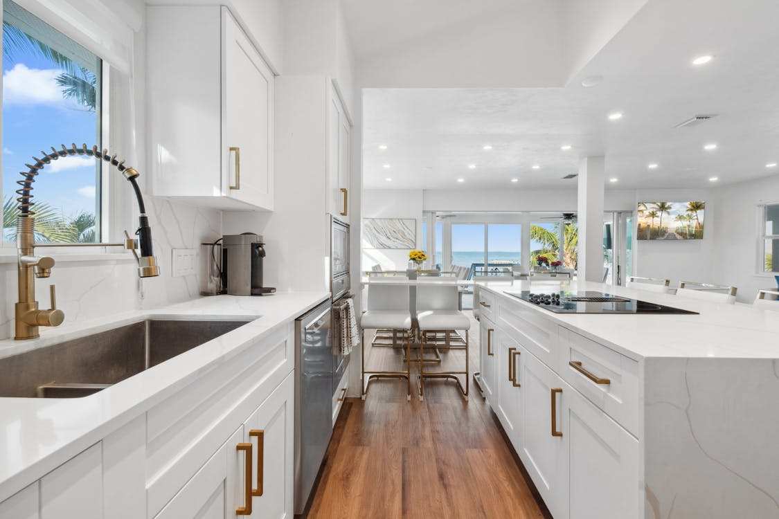 a kitchen space with wooden floors.